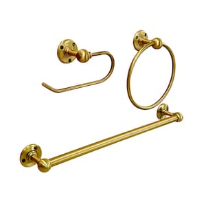 May include: A set of three gold-toned bathroom accessories: a towel bar, a toilet paper holder, and a towel ring.