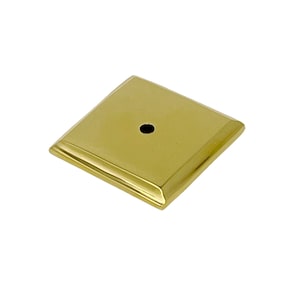May include: A gold square-shaped metal base with a small hole in the center. The base has a beveled edge.
