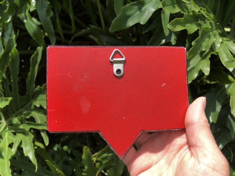 May include: Red wooden speech bubble with a metal hanging hook on the back.