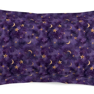 May include: Purple pillowcase with a gold and purple starry night pattern. The pattern features gold stars, moons, and a subtle watercolor effect.