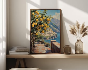 May include: A framed art print depicts a scenic coastal landscape. A lemon tree laden with yellow fruit is in the foreground. A town with buildings and a bridge is on the coast. The artwork is in a wooden frame and is displayed on a shelf.