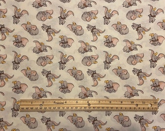 Disney Flying Dumbo on Coral 100% Cotton Fabric **sold per fat quarter** 