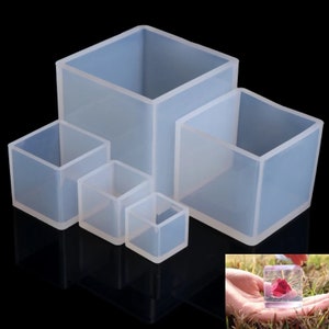May include: Set of four clear silicone square molds of varying sizes. The molds are perfect for making resin crafts, soap, or other DIY projects.