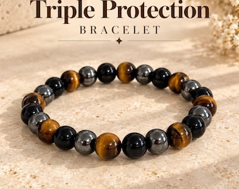 May include: A beaded bracelet featuring alternating round polished stones in shades of golden brown tiger's eye, glossy black obsidian, and metallic gray hematite. The text Triple Protection BRACELET is displayed above the jewelry.
