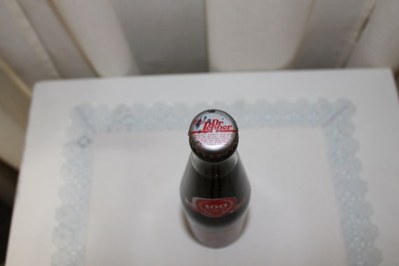 10 OZ COCA COLA COMMEMORATIVE BOTTLE - 1985 INGLES 100TH STORE OPENING