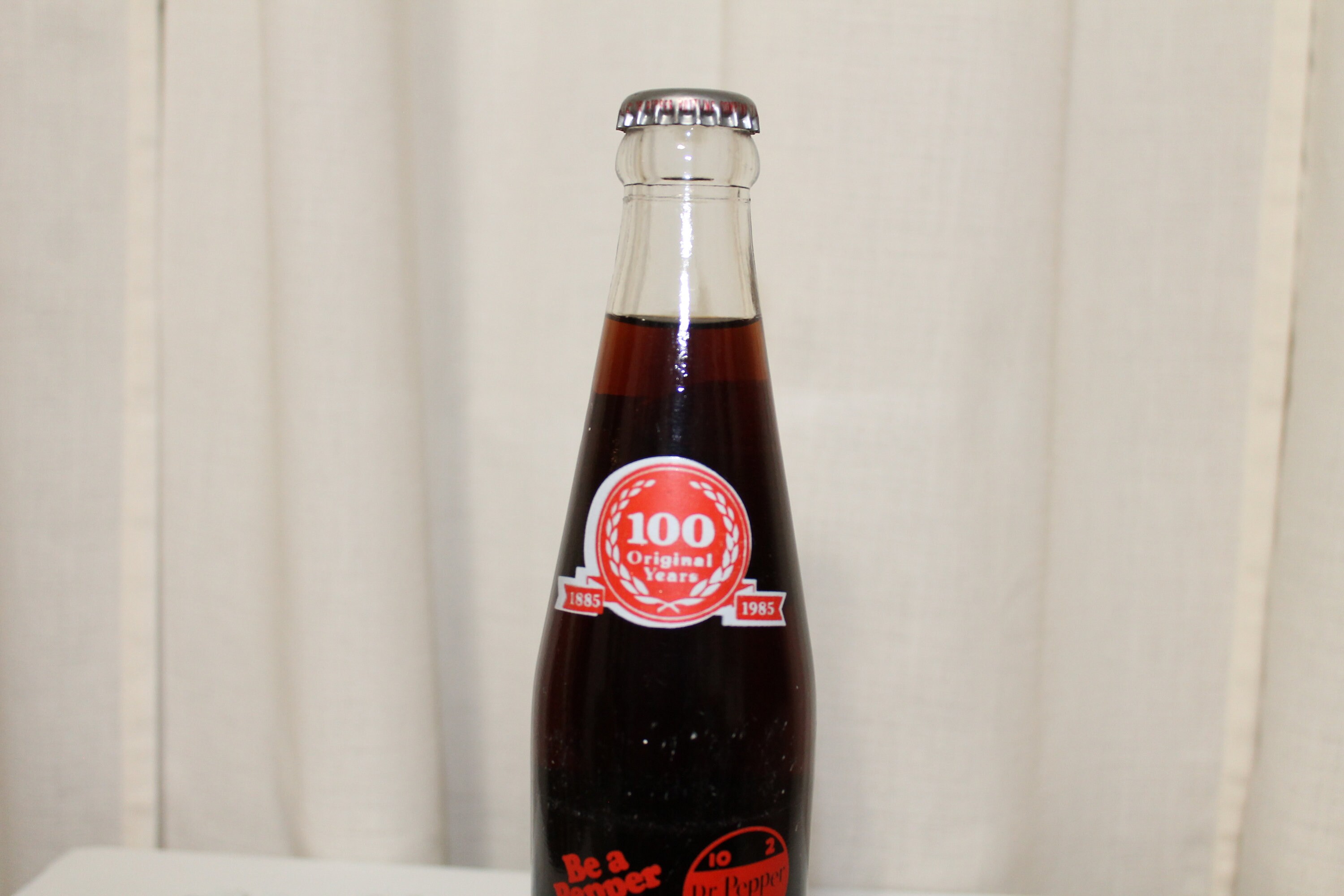 10 OZ COCA COLA COMMEMORATIVE BOTTLE - 1985 INGLES 100TH STORE OPENING