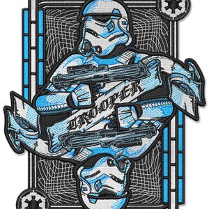 May include: A blue and white embroidered patch featuring a Star Wars Stormtrooper helmet with the text "TROOPER" in a banner.