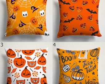 May include: Four square Halloween-themed throw pillows. Designs include pumpkins, bats, ghosts, candy, and the phrases "BOO!!!" and "Trick or Treat?" in orange, white, and black. The pillows are square and appear to be made of fabric.
