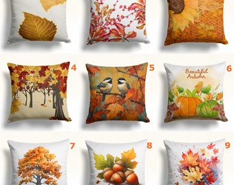 May include: Nine decorative throw pillows with autumn-themed designs. The pillows feature images of fall leaves, sunflowers, pumpkins, acorns, and birds. Colors include shades of orange, yellow, brown, and green. The text "Beautiful Autumn" is on one pillow.