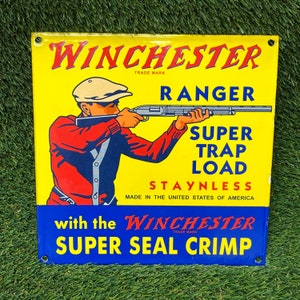 Signo de porcelana vintage Winchester Ranger Super Trap Load Staynless Metal Esmalte Gasolinera Anuncio 10 en amarillo rojo y azul
