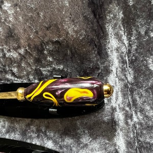 Elegant pen and letter opener set Made in acrylic colour has purple Hughes iridescence and a yellow marking