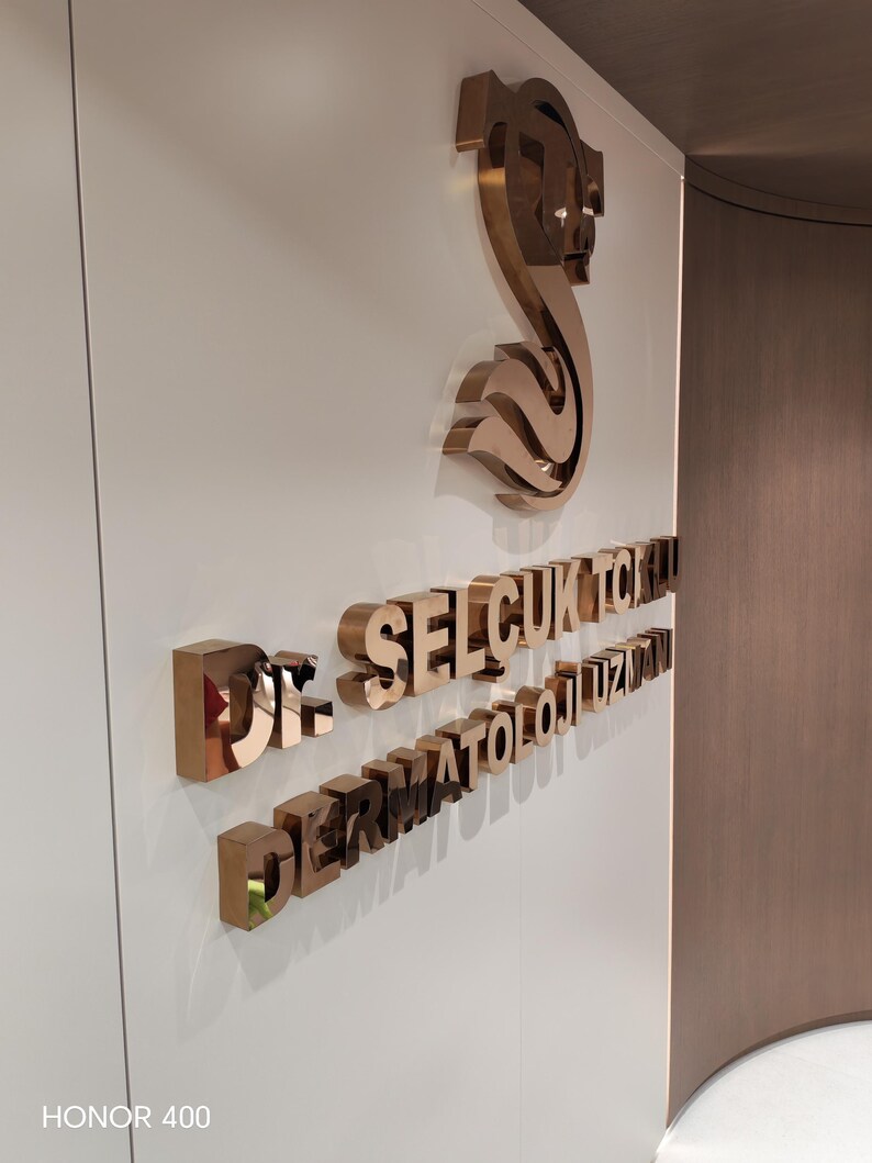 Stainless steel logos and lettering suitable for indoor and outdoor use.