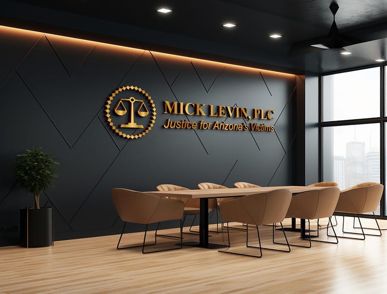 3D logo wall sign made with polished or brushed metal for a custom lobby sign in stainless metal on a dark wall in a modern conference room.