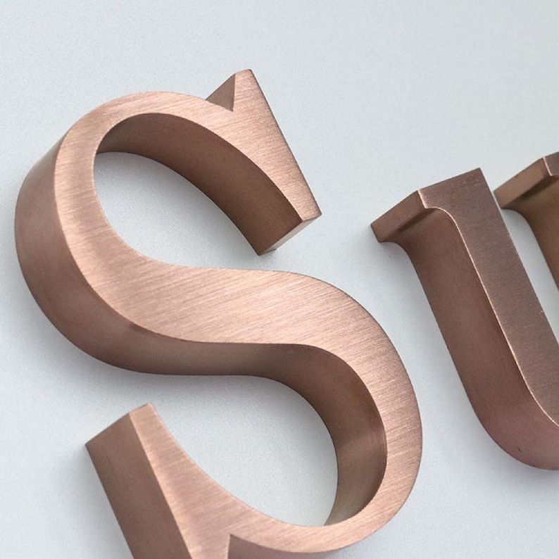 Stainless steel logos and lettering suitable for indoor and outdoor use.