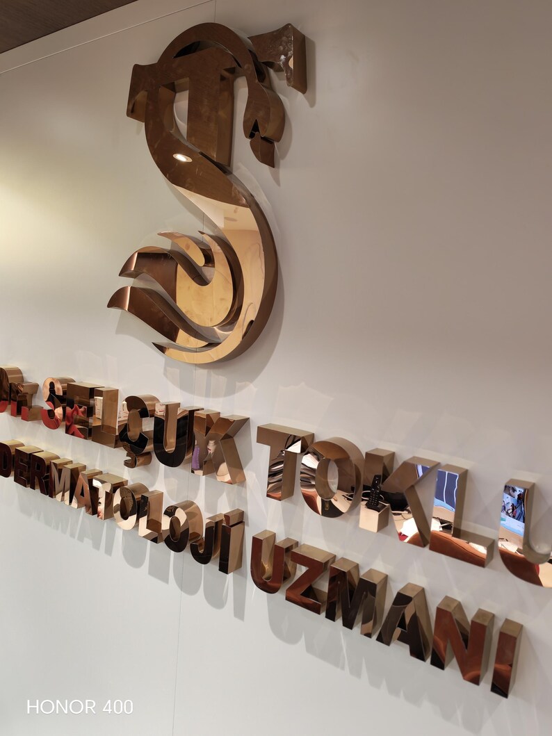 Stainless steel logos and lettering suitable for indoor and outdoor use.