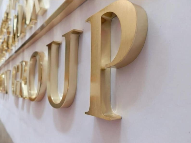 Stainless steel logos and lettering suitable for indoor and outdoor use.