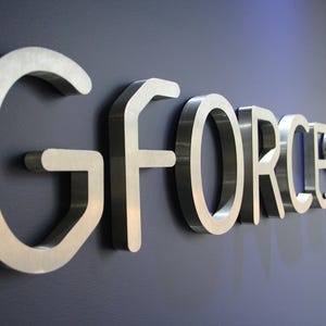 Stainless steel logos and lettering suitable for indoor and outdoor use.
