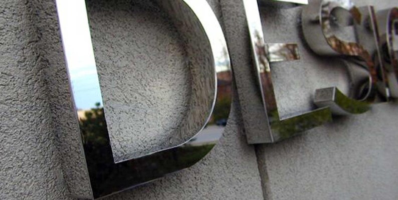 Stainless steel logos and lettering suitable for indoor and outdoor use.