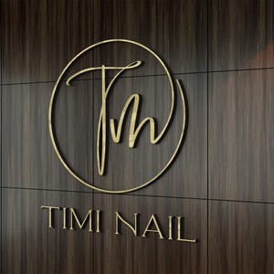 3D logo wall sign made with polished or brushed metal for a custom lobby sign in stainless metal on a dark wall in a modern conference room