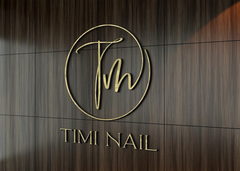 3D logo wall sign made with polished or brushed metal for a custom lobby sign in stainless metal on a dark wall in a modern conference room