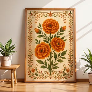 Può includere: Stampa floreale incorniciata con tre grandi fiori arancioni, foglie verdi e boccioli. L'opera d'arte è ambientata su uno sfondo color crema con un bordo decorativo ed è esposta su un pavimento in legno.