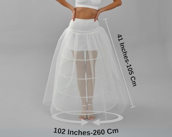 May include: A white tulle petticoat with multiple layers and a 41-inch length. The petticoat has a 102-inch circumference.