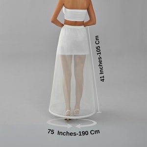 May include: White tulle wedding petticoat with a 41 inch (105 cm) length and a 75 inch (190 cm) circumference.