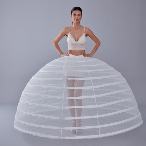 skirt of jane's dress to see the white petticoats pocking Replying to @velociraptera Yes! Petticoats under dresses = INSTANT UPG
