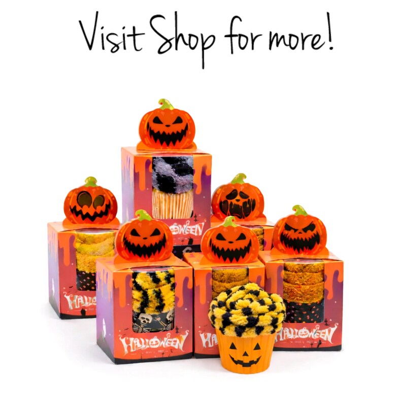 May include: A display of Halloween-themed gift boxes, each topped with a carved orange pumpkin. The boxes feature various designs, including black and yellow patterns, and the text "Halloween". The phrase "Visit Shop for more!" is at the top.