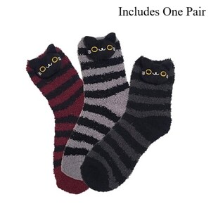 May include: Three pairs of fuzzy cat-themed socks. Each sock features a black cat face design at the top with yellow eyes and a striped pattern in burgundy, gray, and black. The text "Includes One Pair" is at the top.