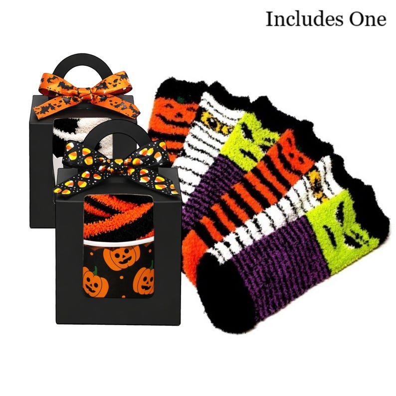 May include: Halloween-themed socks in black gift boxes with orange and black bows. The socks feature pumpkin, mummy, and striped designs. The text "Includes One" is visible.