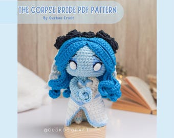 May include: A crochet pattern for a blue and white amigurumi doll of the Corpse Bride, with a black flower crown and a white rose. The pattern is available as a PDF download. The text "THE CORPSE BRIDE PDF PATTERN" and "By Cuckoo Craft" is visible in the image.