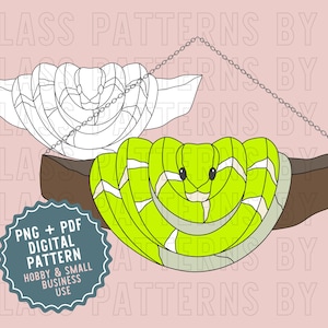 May include: A digital pattern for stained glass featuring a green snake with white stripes coiled on a brown branch. The pattern is available as a PNG and PDF file and is for hobby and small business use.