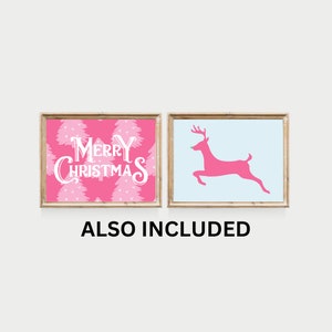 May include: Two printable Christmas signs in a pink and white colour scheme. One sign says "Merry Christmas" with a pink background and white trees. The other sign has a light blue background with a pink reindeer.