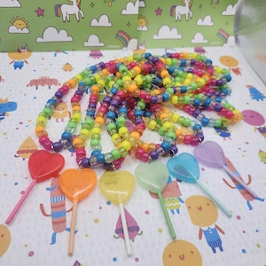 The necklaces are in a neat pile. The lollipops are in the order of the rainbow.