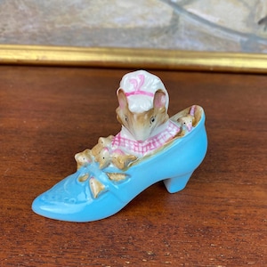 May include: A rustic wooden sign with the text "Welcome to our porch" in white lettering. The sign features a distressed finish and a simple, inviting design, perfect for outdoor decor.