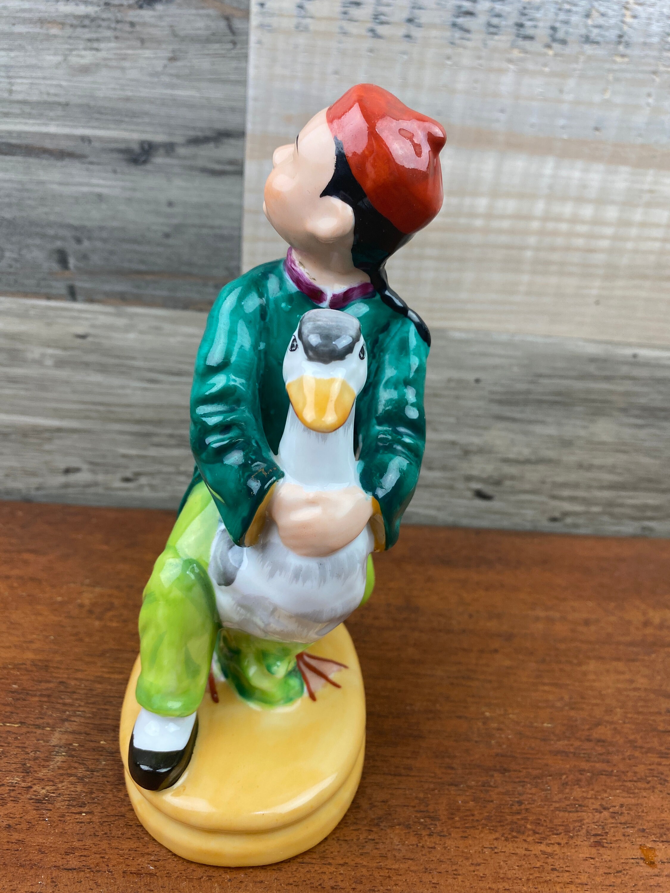 Japanese Hand Painted Figurine of a Boy Riding on a Goose