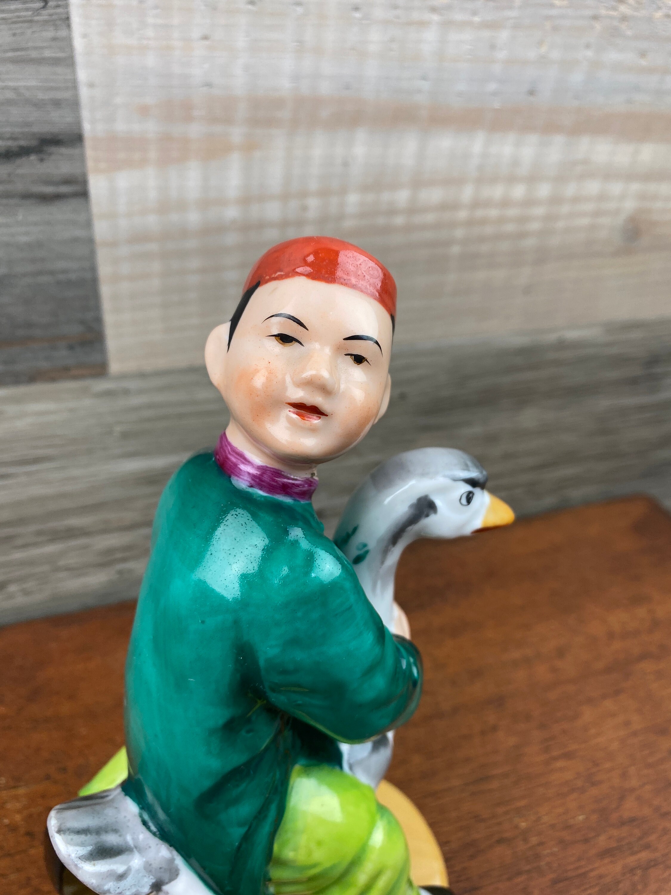 Japanese Hand Painted Figurine of a Boy Riding on a Goose