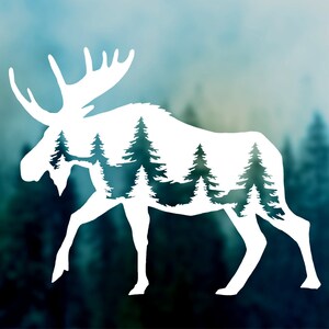 May include: White silhouette of a moose with a forest scene inside its body. The moose is standing on a blurred background of trees.