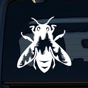 May include: White silhouette of a bee with a forest inside its body. The bee is facing forward with its wings spread out.