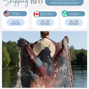 May include: A burgundy throw blanket with a moth and butterfly design. The blanket features a central moth illustration with a full moon backdrop, surrounded by butterflies and foliage. The blanket has a fringed edge.