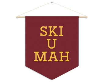 May include: A maroon pennant banner with the text "SKI U MAH" in yellow letters.