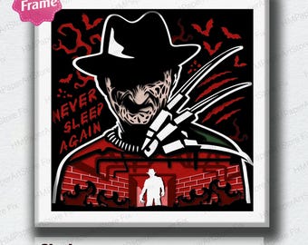 May include: A shadow box art piece featuring a stylized image of Freddy Krueger. The artwork includes the text "NEVER SLEEP AGAIN" and a silhouette of a figure in a hat. The design incorporates bats, a red and black color scheme, and a brick wall background.