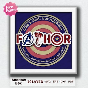 May include: A framed shadow box design featuring the word "FATHOR" in red and white, with superhero symbols and the text "Like a dad, but mightier." The design incorporates a hammer and shield.