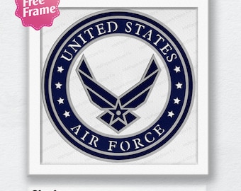 May include: A blue and silver circle with the words "United States Air Force" and a star in the center. The circle is surrounded by a ring of stars.