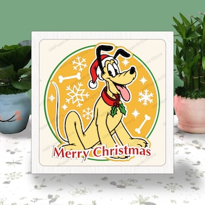 May include: A square Christmas card featuring Pluto the dog wearing a Santa hat and a red collar with holly. The background is yellow with snowflakes and bone shapes. The words "Merry Christmas" are at the bottom.