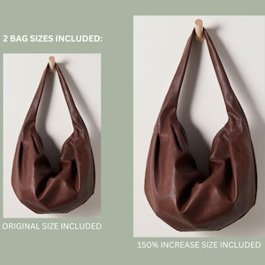 May include: Two brown leather handbags hanging on hooks. The text "2 BAG SIZES INCLUDED: ORIGINAL SIZE INCLUDED 150% INCREASE SIZE INCLUDED" is displayed below the handbags.