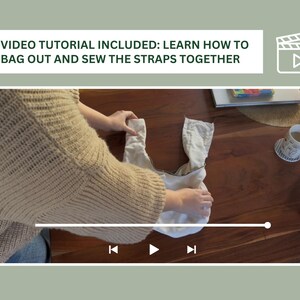 May include: A person is shown bagging out a white fabric bag with black straps. The video tutorial included text is "VIDEO TUTORIAL INCLUDED: LEARN HOW TO BAG OUT AND SEW THE STRAPS TOGETHER".