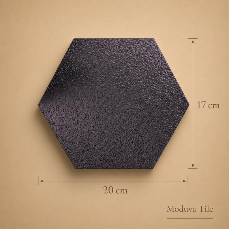 May include: A black, textured, hexagonal tile, 20 cm wide and 17 cm high. The tile has a rough surface and is displayed against a neutral background. The text "Moduva Tile" is visible.