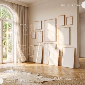 May include: A display of rectangular picture frames with wooden edges, in various sizes, arranged on a wall and leaning against it. The room has a neutral color scheme, a wooden floor, and a rug.